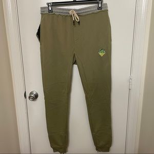 Green joggers pink dolphin